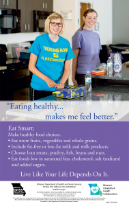 Healthy Living poster that shows two women posing by a kitchen counter as they cook healthy food